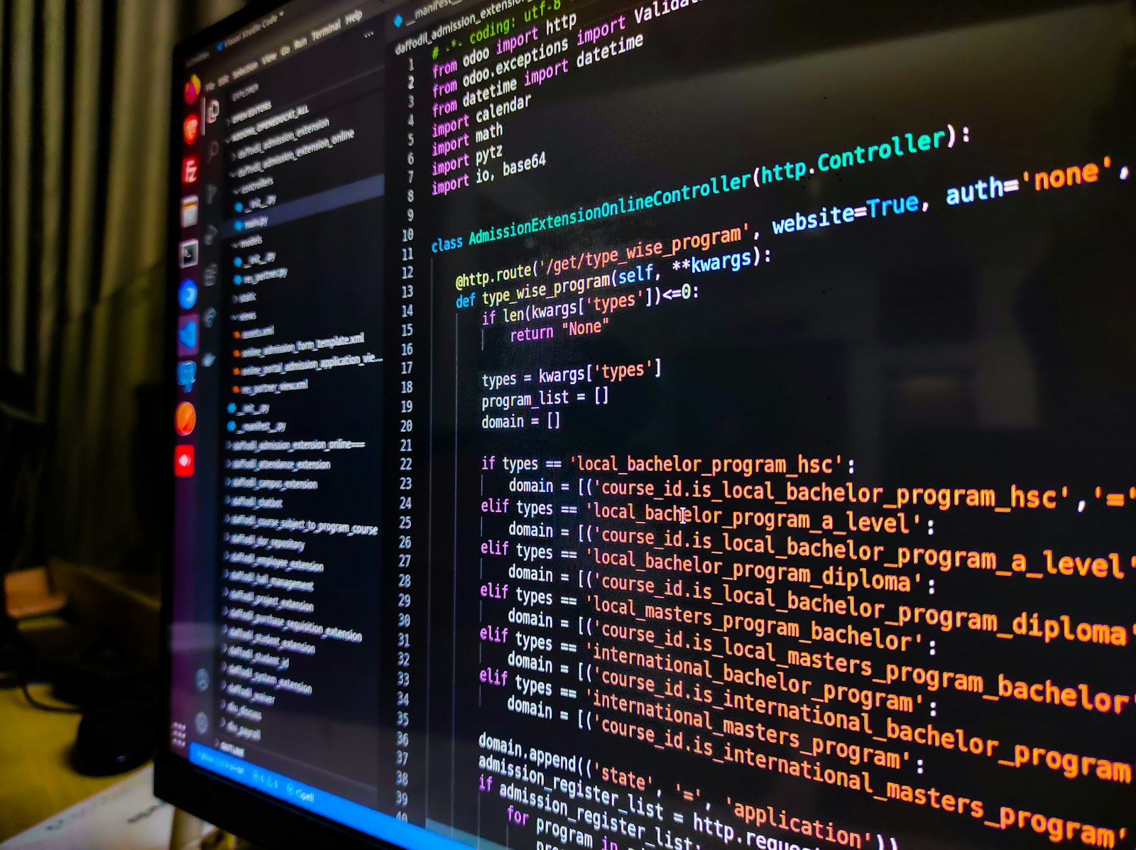 A code editor open on a monitor in a dim room